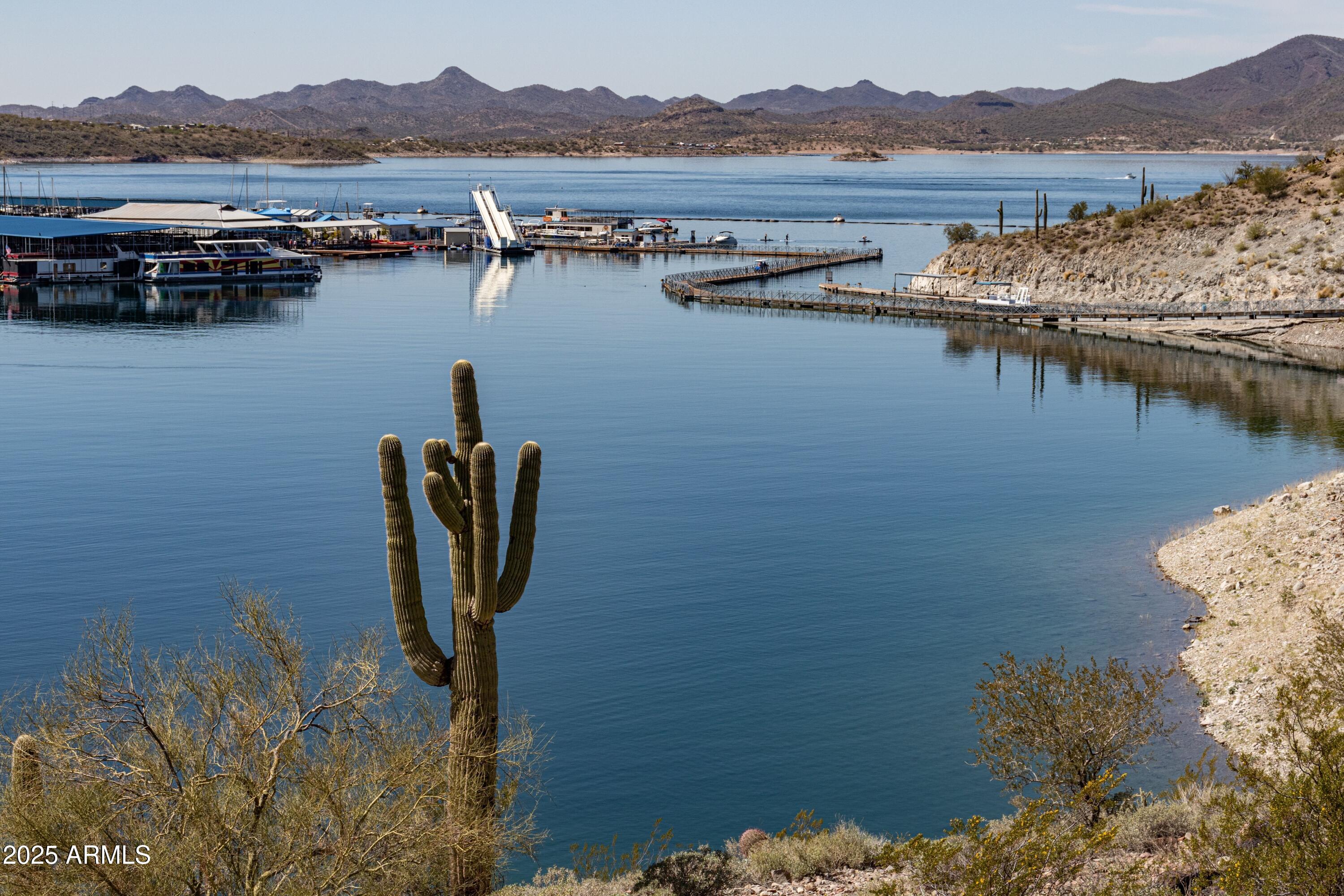 9916 West Redbird Road Peoria, AZ 85383 - Photo 74 of 96 a view of a lake with mountain