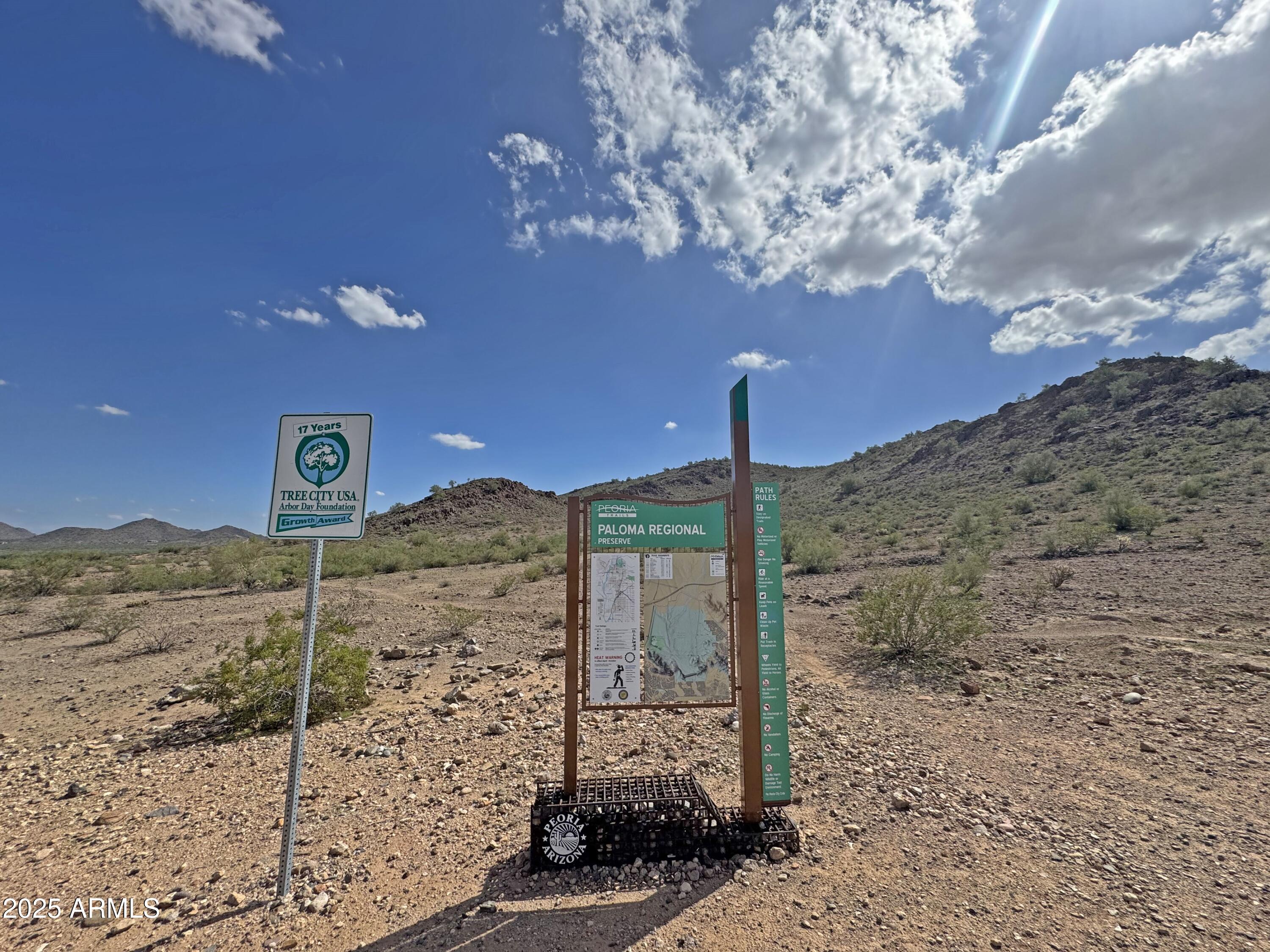 9916 West Redbird Road Peoria, AZ 85383 - Photo 78 of 96 a sign board with a building in the background