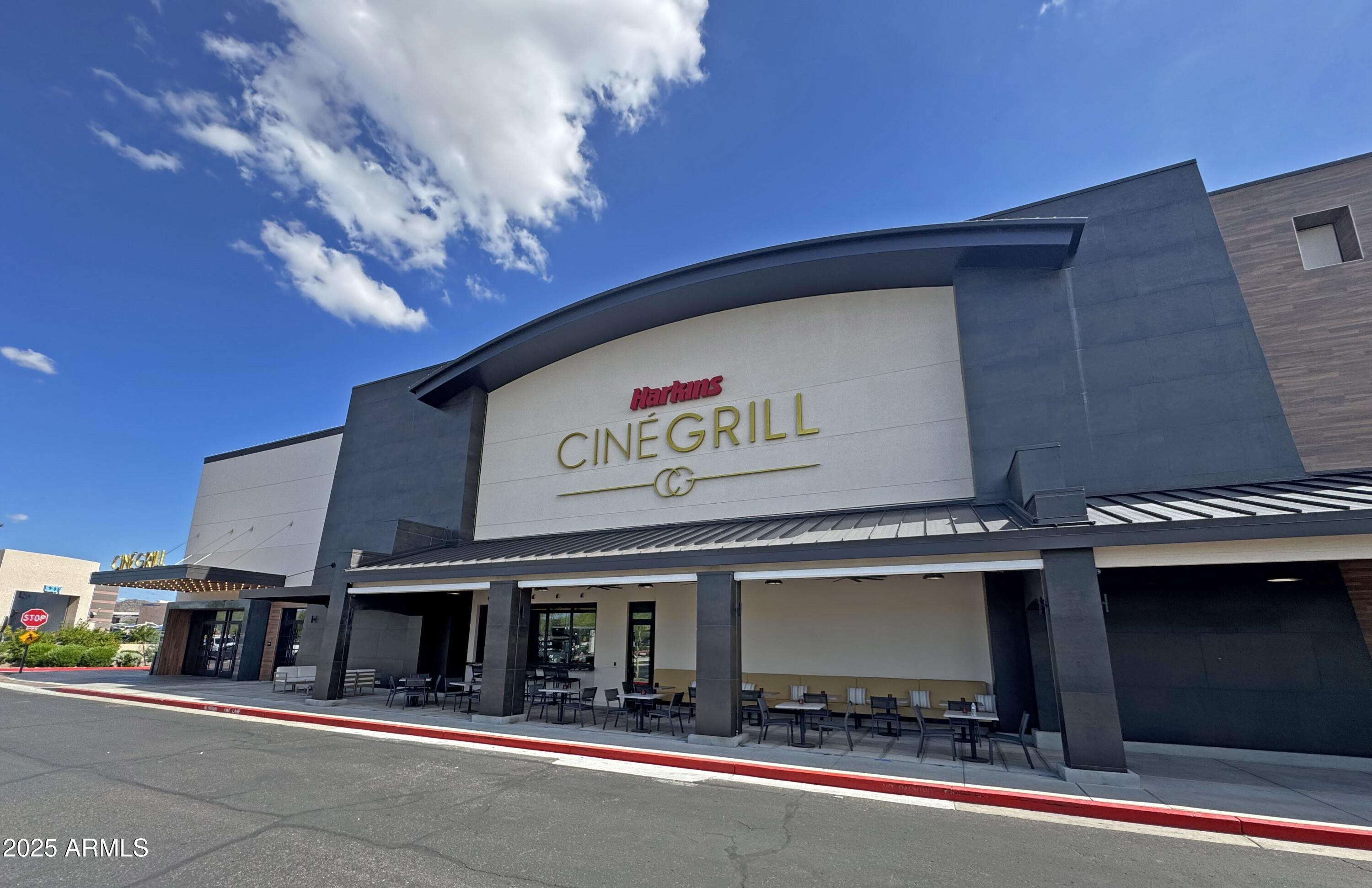 9916 West Redbird Road Peoria, AZ 85383 - Photo 83 of 96 a view of a building with retail shops and traffic signal