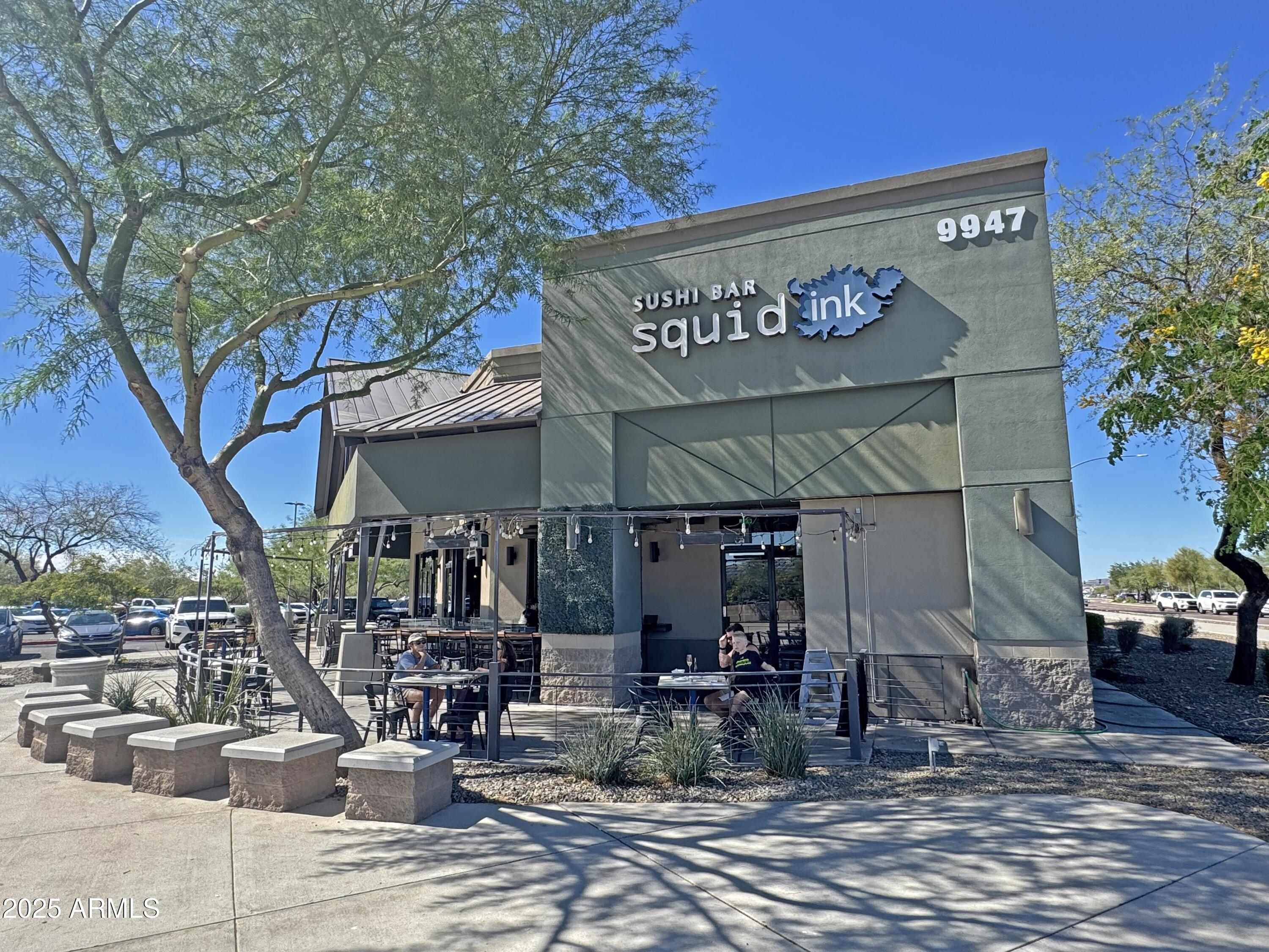 9916 West Redbird Road Peoria, AZ 85383 - Photo 88 of 96 a view of a cafe with a table and chairs under an umbrella