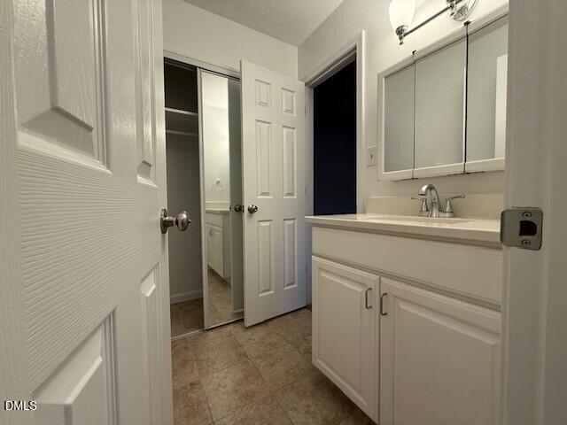 5800 Falls Of Neuse Road, Unit A Raleigh, NC 27609 - Photo 15 of 32 a bathroom with a sink and a mirror