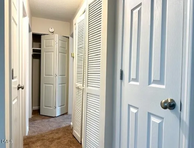 a view of a hallway with windows