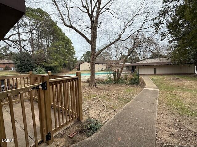 5800 Falls Of Neuse Road, Unit A Raleigh, NC 27609 - Photo 28 of 32 a view of a house with backyard and trees