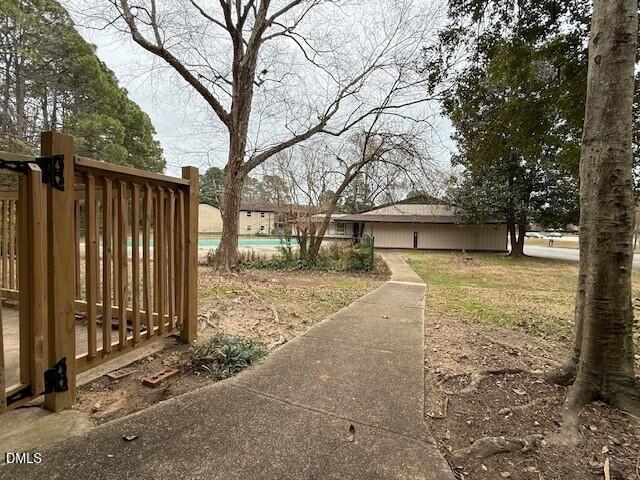 5800 Falls Of Neuse Road, Unit A Raleigh, NC 27609 - Photo 32 of 32 a view of a yard with wooden fence
