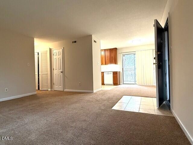 5800 Falls Of Neuse Road, Unit A Raleigh, NC 27609 - Photo 4 of 32 an empty room with windows and fireplace