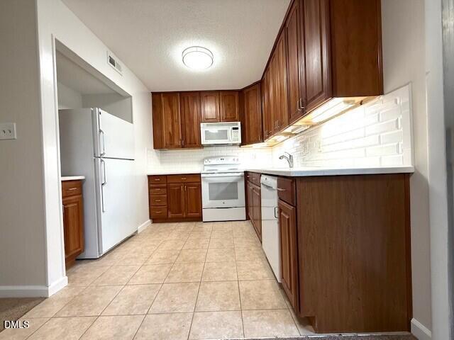 5800 Falls Of Neuse Road, Unit A Raleigh, NC 27609 - Photo 9 of 32 a kitchen with stainless steel appliances granite countertop a sink and cabinets