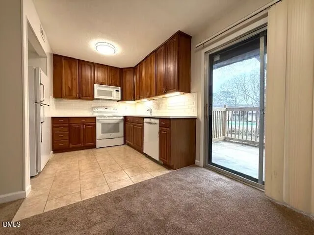 a view of kitchen with cabinets and wooden floor