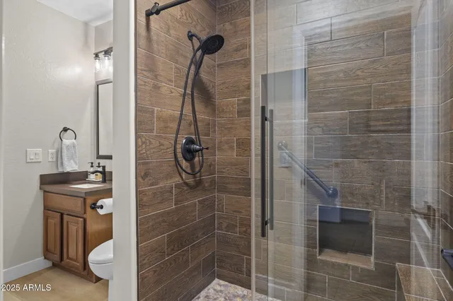 a bathroom with a tub a sink and a mirror