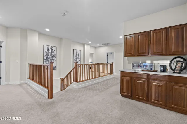 a bathroom with a granite countertop sink a mirror bathtub and shower