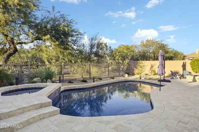 an aerial view of residential building and lake