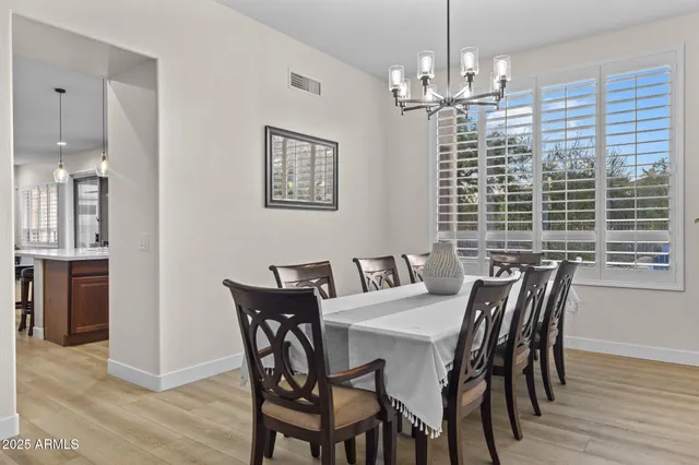 a kitchen with stainless steel appliances granite countertop a sink refrigerator and cabinets
