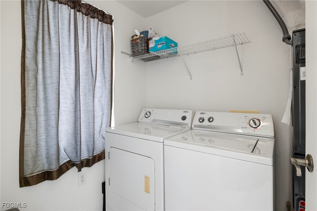 2745 First Street, Unit 2306 Fort Myers, FL 33916 - Photo 14 of 31 a view of storage and utility room with washer and dryer