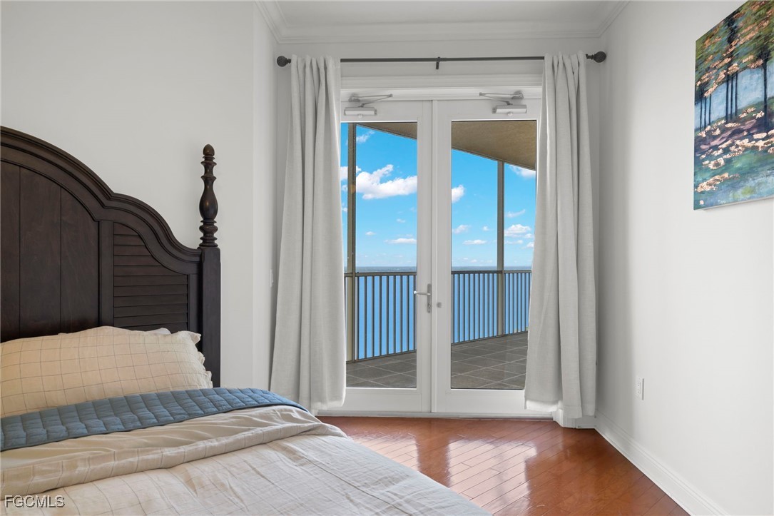 2745 First Street, Unit 2306 Fort Myers, FL 33916 - Photo 17 of 31 a bedroom with a bed and a window