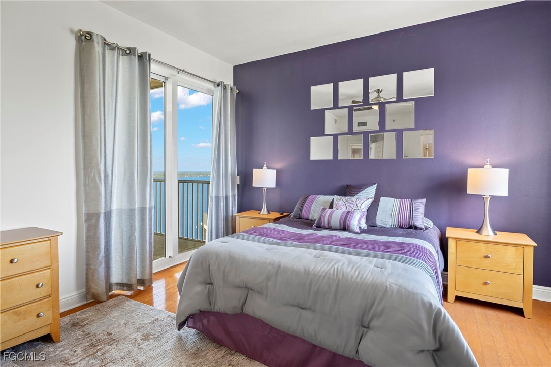 2745 First Street, Unit 2306 Fort Myers, FL 33916 - Photo 23 of 31 a bedroom with a bed and a window
