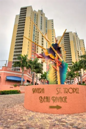 a view of a swimming pool and an outdoor seating