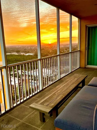a living room with furniture and a ceiling fan