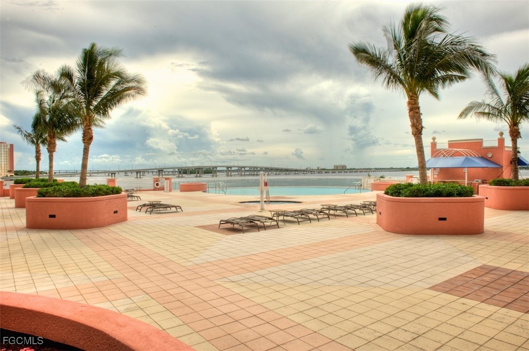 2745 First Street, Unit 2306 Fort Myers, FL 33916 - Photo 31 of 31 a view of a swimming pool and an outdoor seating