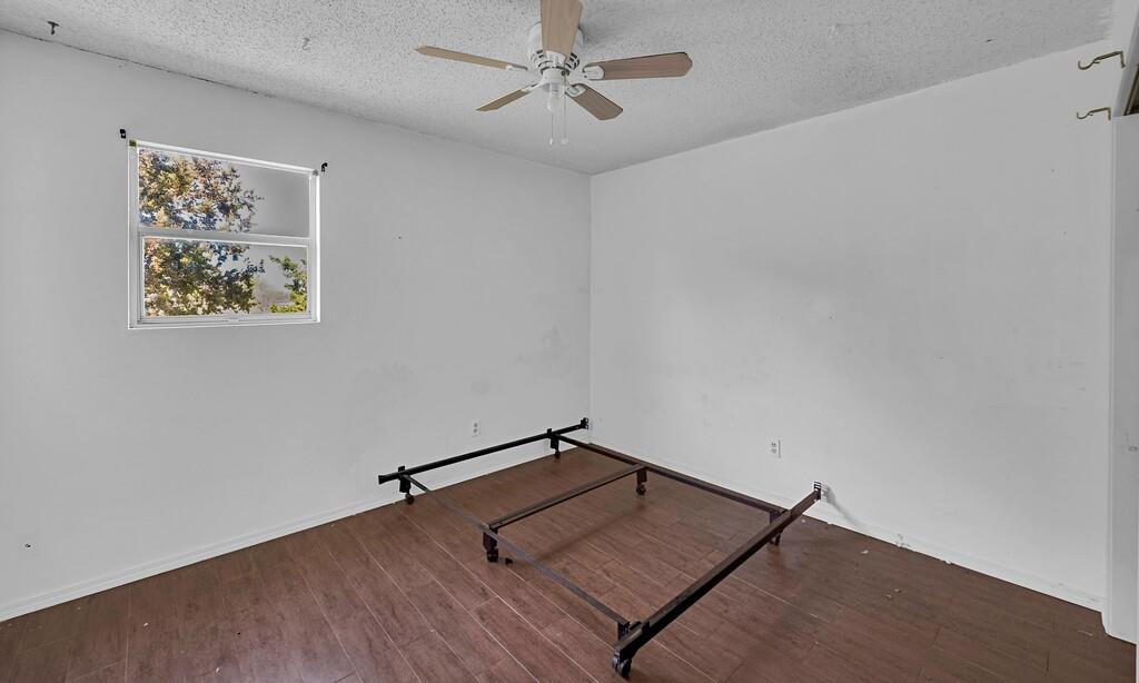 105 County Road 3590 China Spring, TX 76633 - Photo 11 of 30 an empty room with a painting on the wall