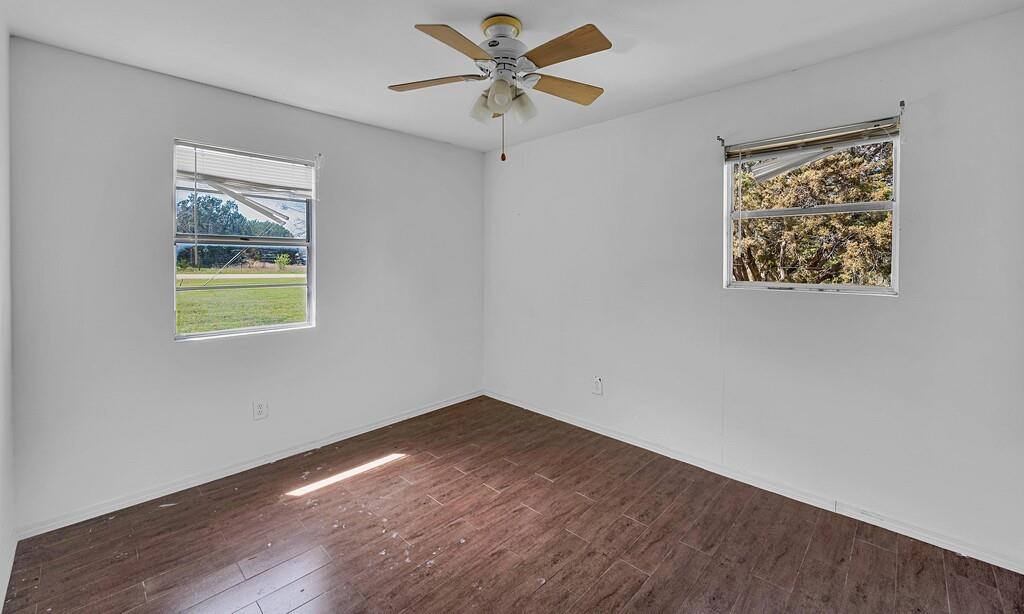 105 County Road 3590 China Spring, TX 76633 - Photo 13 of 30 a view of an empty room with window and a chandelier fan