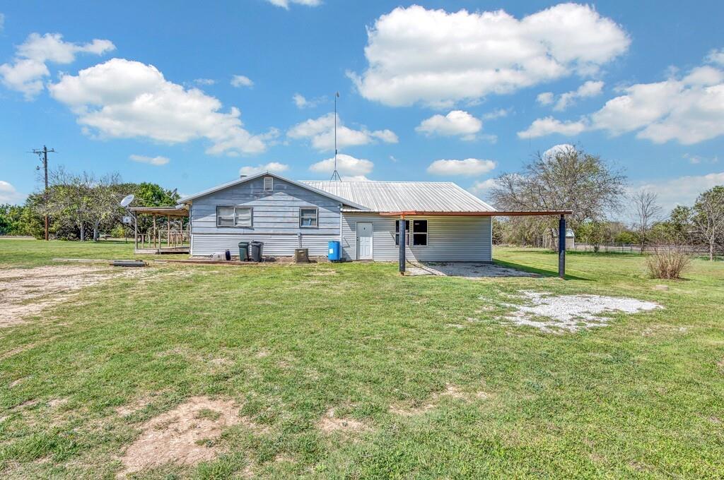 105 County Road 3590 China Spring, TX 76633 - Photo 22 of 30 a house view with a garden space