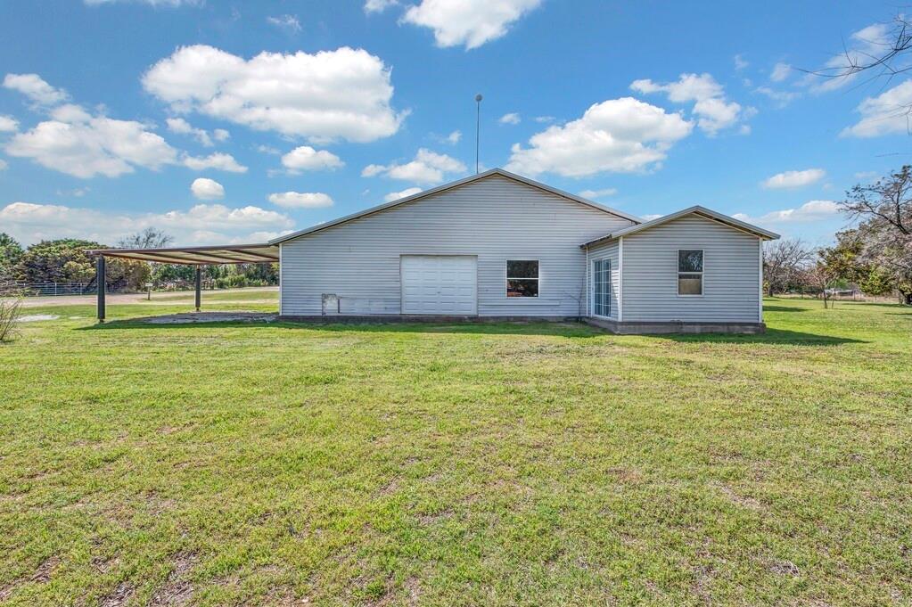 105 County Road 3590 China Spring, TX 76633 - Photo 23 of 30 a view of a house with a backyard