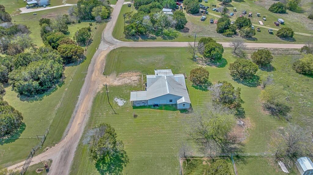 105 County Road 3590 China Spring, TX 76633 - Photo 28 of 30 an aerial view of a house with a yard