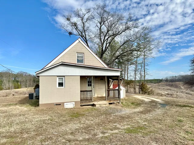 a view of a yard with a tree