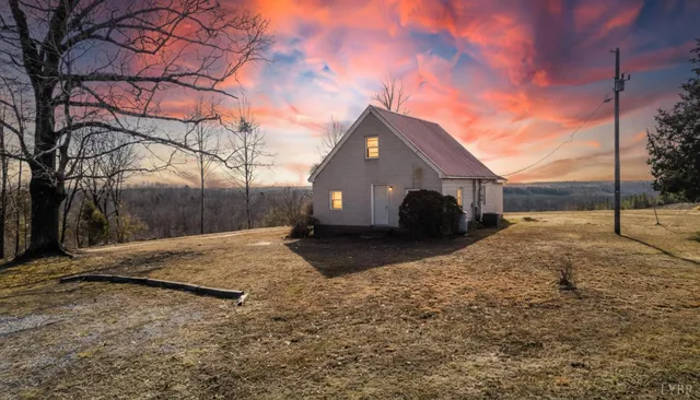 a view of a house with snow on the road