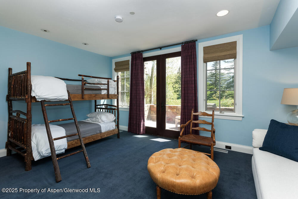 74 Pfister Drive, Unit 101 Aspen, CO 81611 - Photo 16 of 24 a living room with furniture and a large window