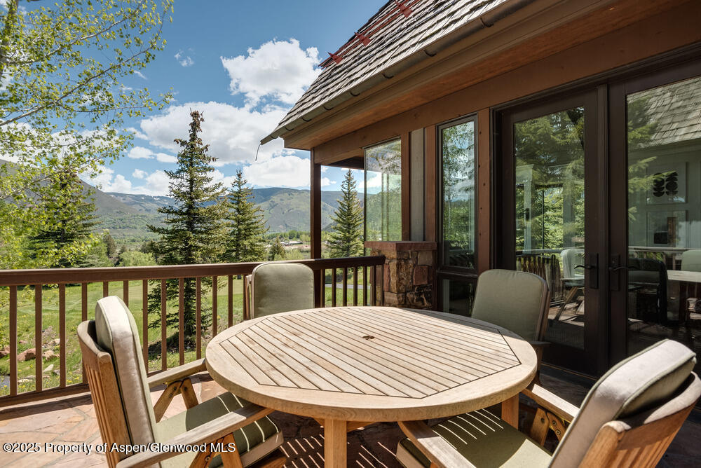 74 Pfister Drive, Unit 101 Aspen, CO 81611 - Photo 19 of 24 a view of a dining room with furniture window and outside view