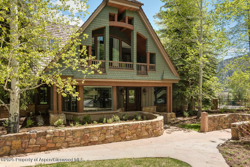 74 Pfister Drive, Unit 101 Aspen, CO 81611 - Photo 20 of 24 a view of a house with a yard