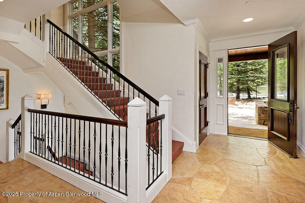 74 Pfister Drive, Unit 101 Aspen, CO 81611 - Photo 7 of 24 a view of staircase with white walls and windows