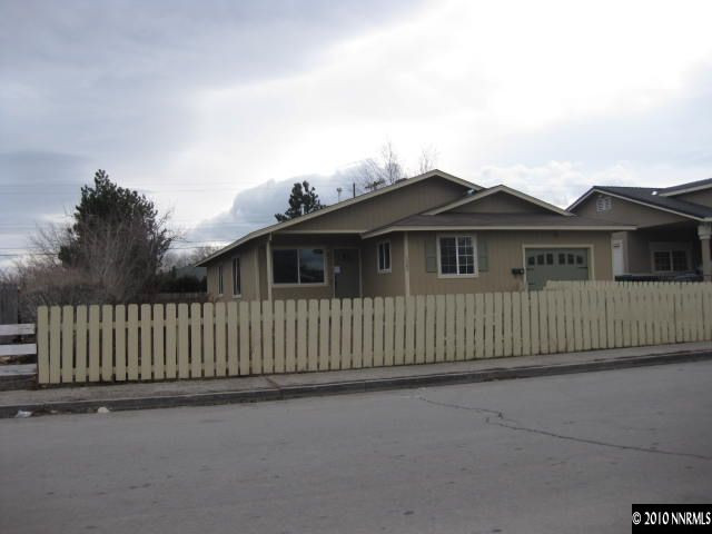 1580 Trainer Way Reno, NV 89512 - Photo 1 of 9 a view of a house with a wooden fence