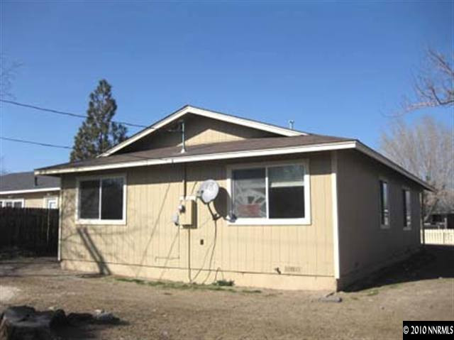 1580 Trainer Way Reno, NV 89512 - Photo 2 of 9 a front view of a house with a yard