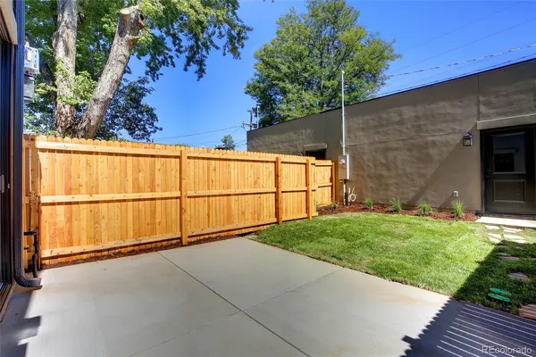 a view of a backyard of the house