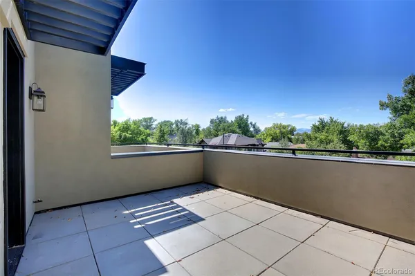 a view of balcony with furniture