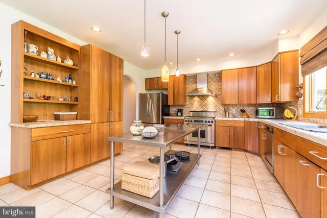 a bedroom with a bed and a large mirror