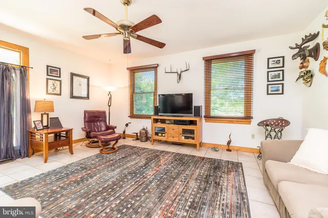 a bathroom with a sink mirror and toilet