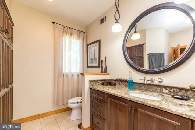 a picture of a bench in front of a building