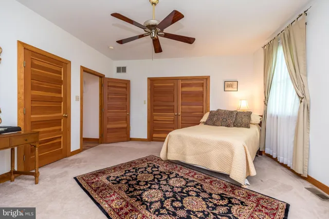 a view of a house with backyard porch and sitting area