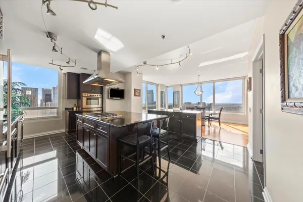 a kitchen with granite countertop a stove and a sink