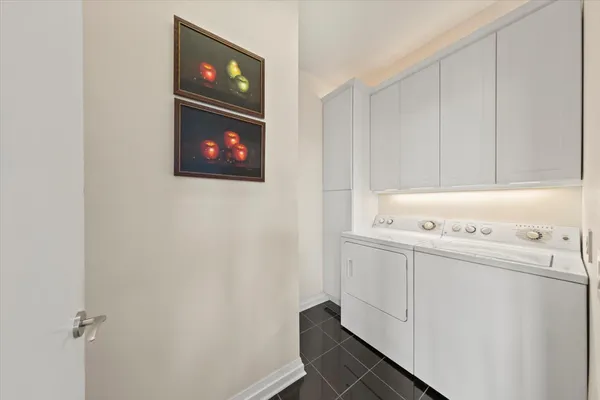 a kitchen with stainless steel appliances kitchen island granite countertop a refrigerator and a stove