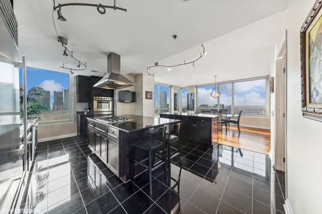 a dining room with furniture and wooden floor