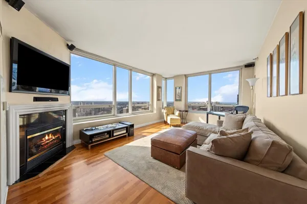 a living room with furniture and a large window