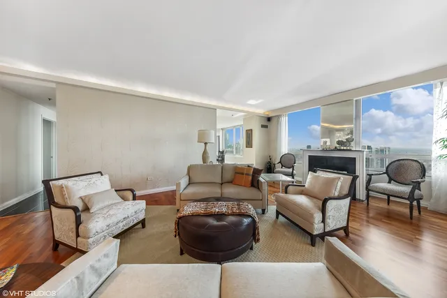a living room with furniture window and wooden floor