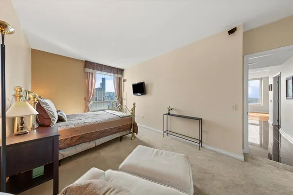 a bedroom with furniture and a couch