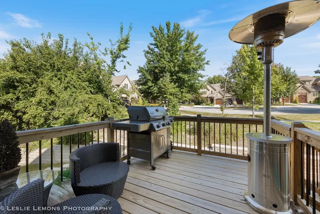 a view of a balcony with furniture