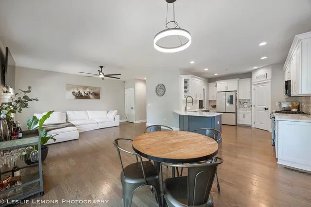 a view of a dining room with furniture and wooden floor