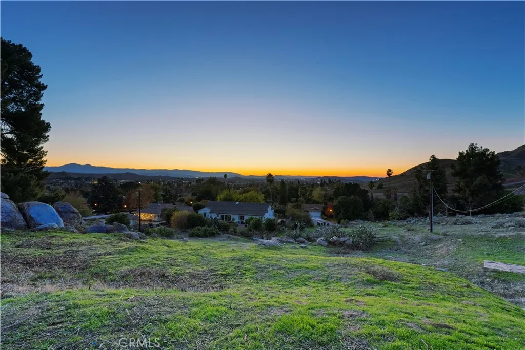 2935 Galaxie Road Riverside, CA 92507 - Photo 42 of 45 a view of a grassy field with trees