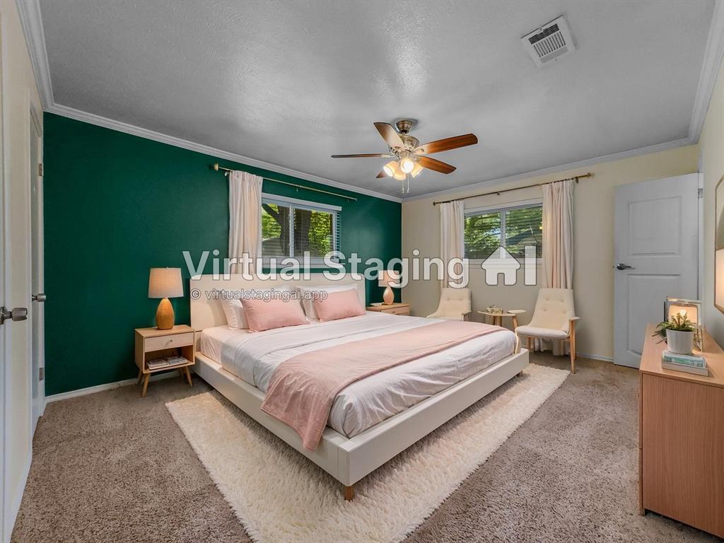 220 Cooper Drive Hurst, TX 76053 - Photo 17 of 27 a bedroom with a large bed and a chandelier